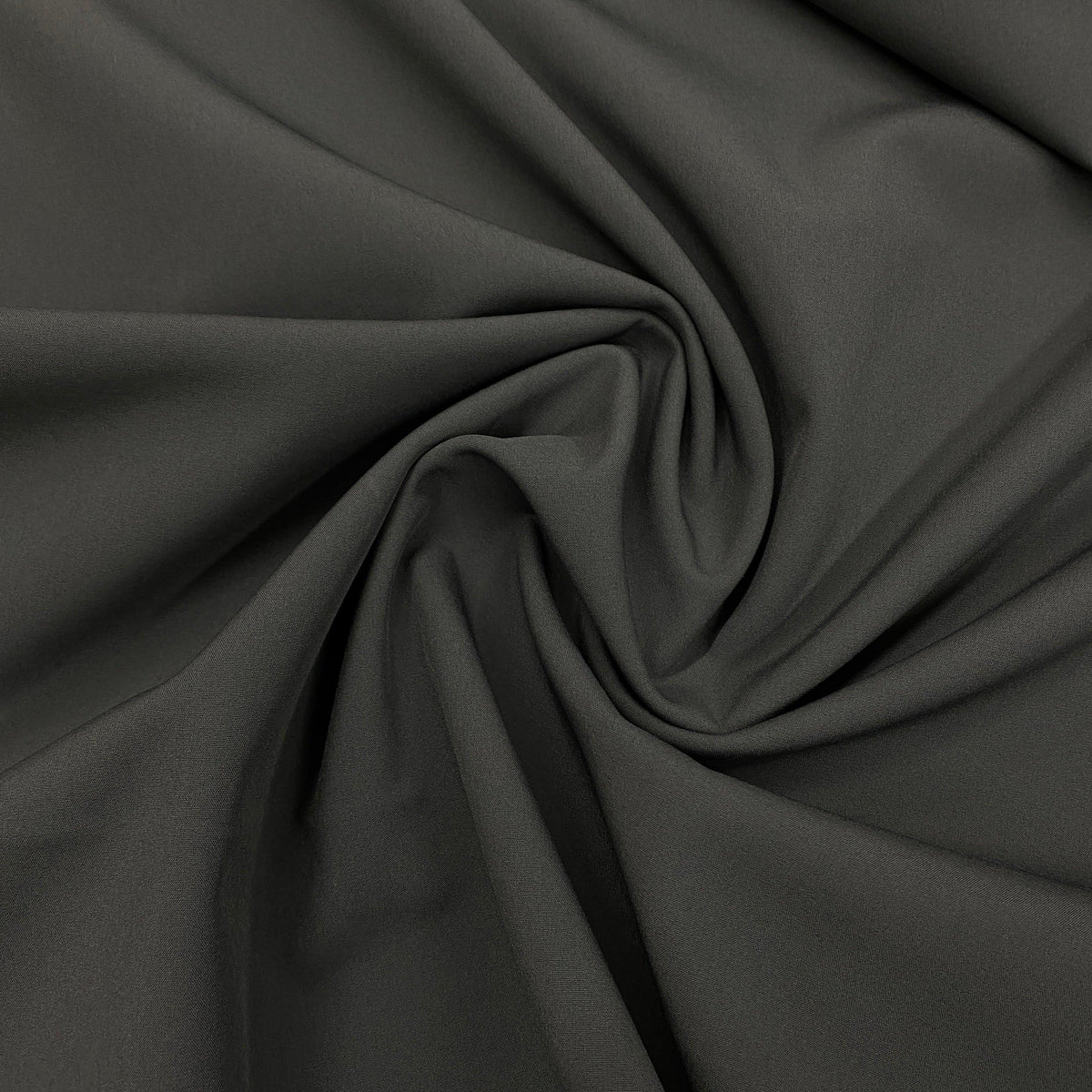Close-up of draped dark grey premium natural fabric from Nature's Fabrics.