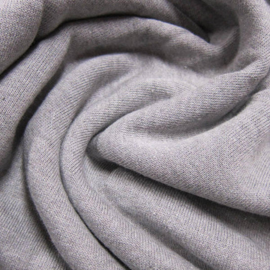 Close-up of draped grey organic cotton fabric from Nature's Fabrics