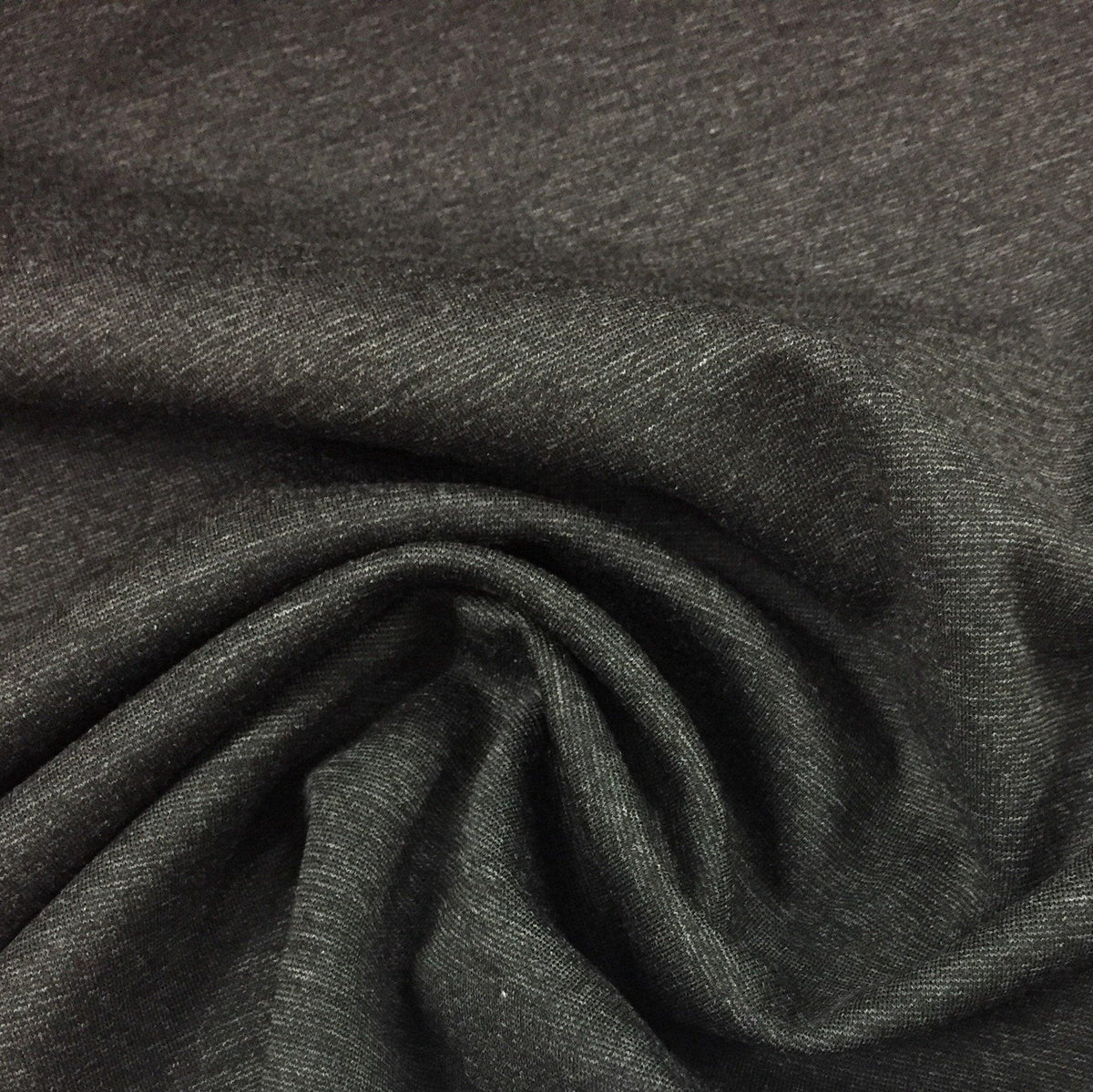 Close-up of draped charcoal grey natural fabric from Nature's Fabrics