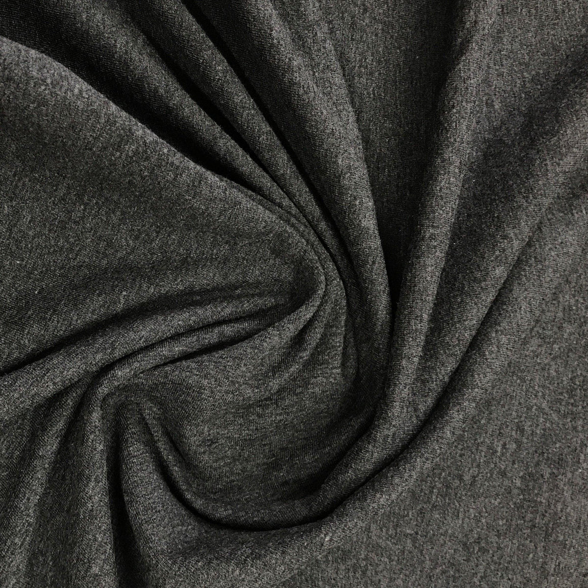 Close-up of draped charcoal grey natural fabric from Nature's Fabrics