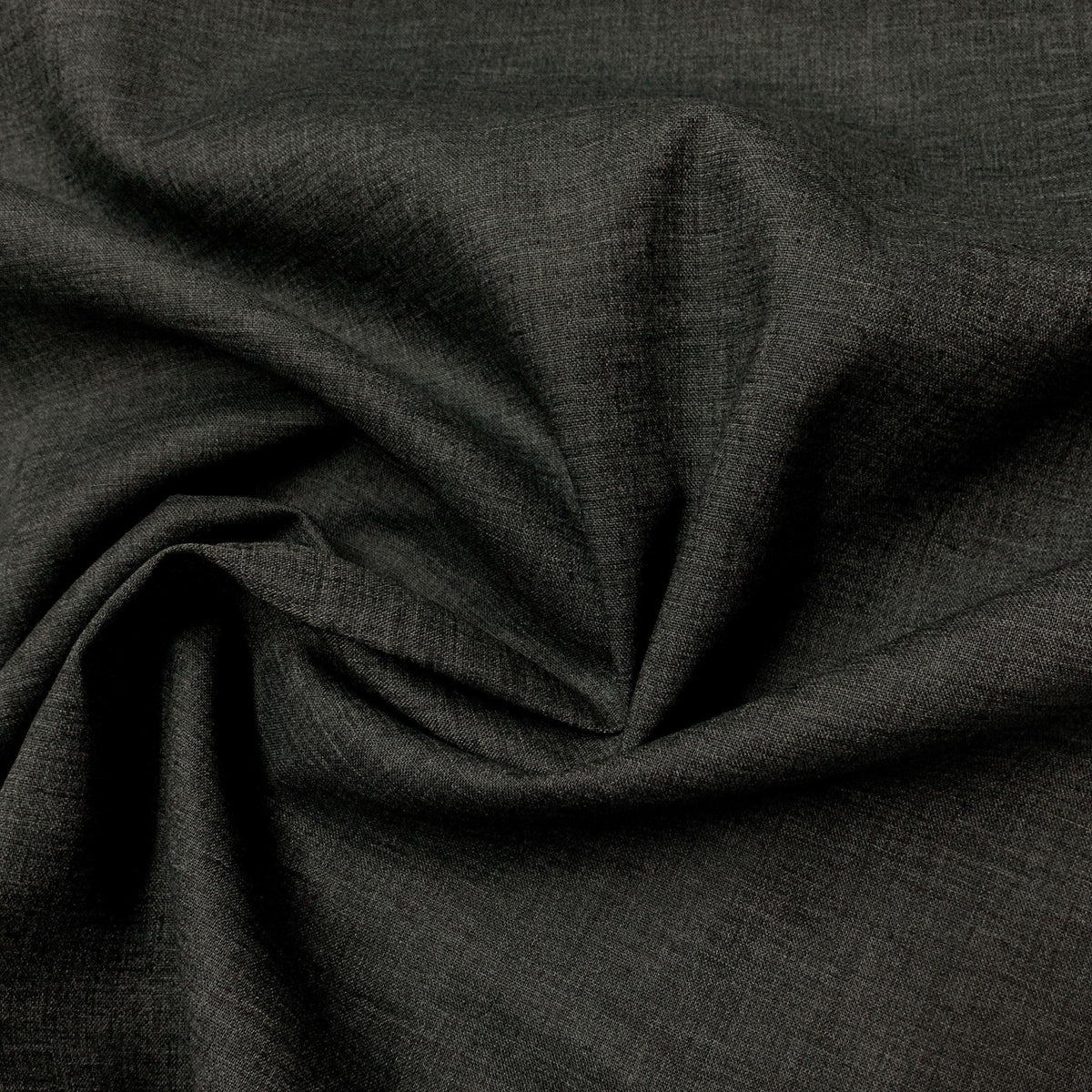 Close-up of draped dark charcoal grey natural fabric from Nature's Fabrics.