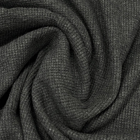Close-up of draped charcoal grey ribbed natural fabric from Nature's Fabrics