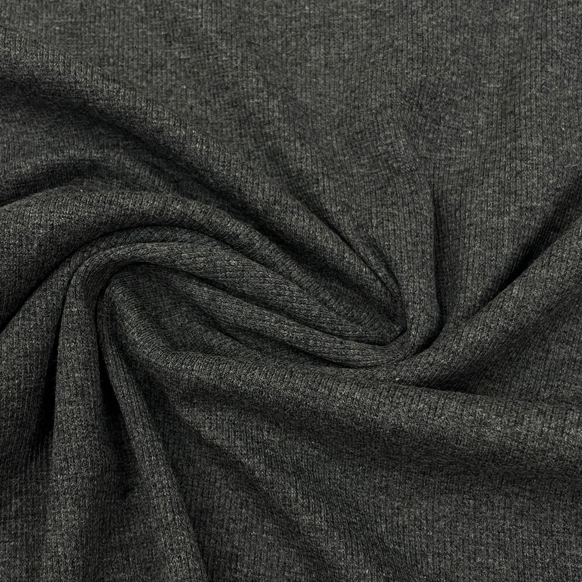 Close-up of draped charcoal grey natural fabric from Nature's Fabrics.
