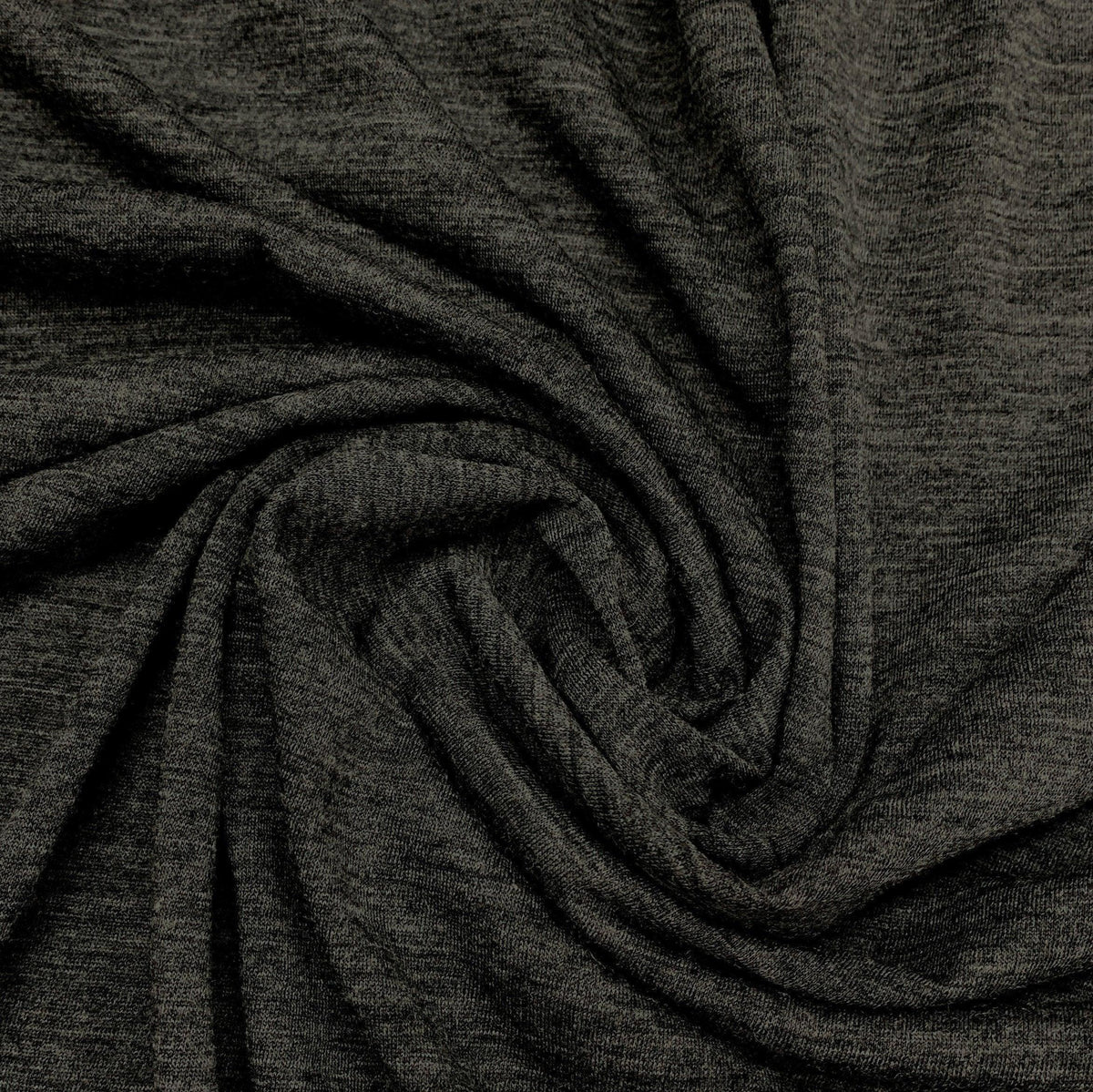 Dark charcoal grey natural fabric draped in a spiral by Nature's Fabrics