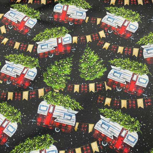 Nature's Fabrics holiday print featuring red and white campers with Christmas trees and bunting.