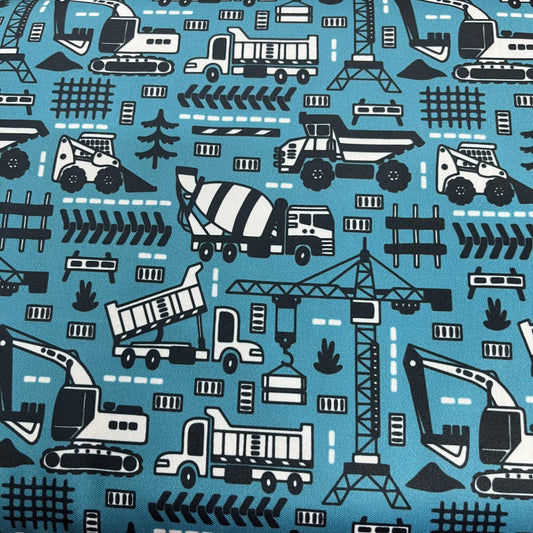 Blue Nature's Fabrics cotton fabric with white and black construction vehicle pattern