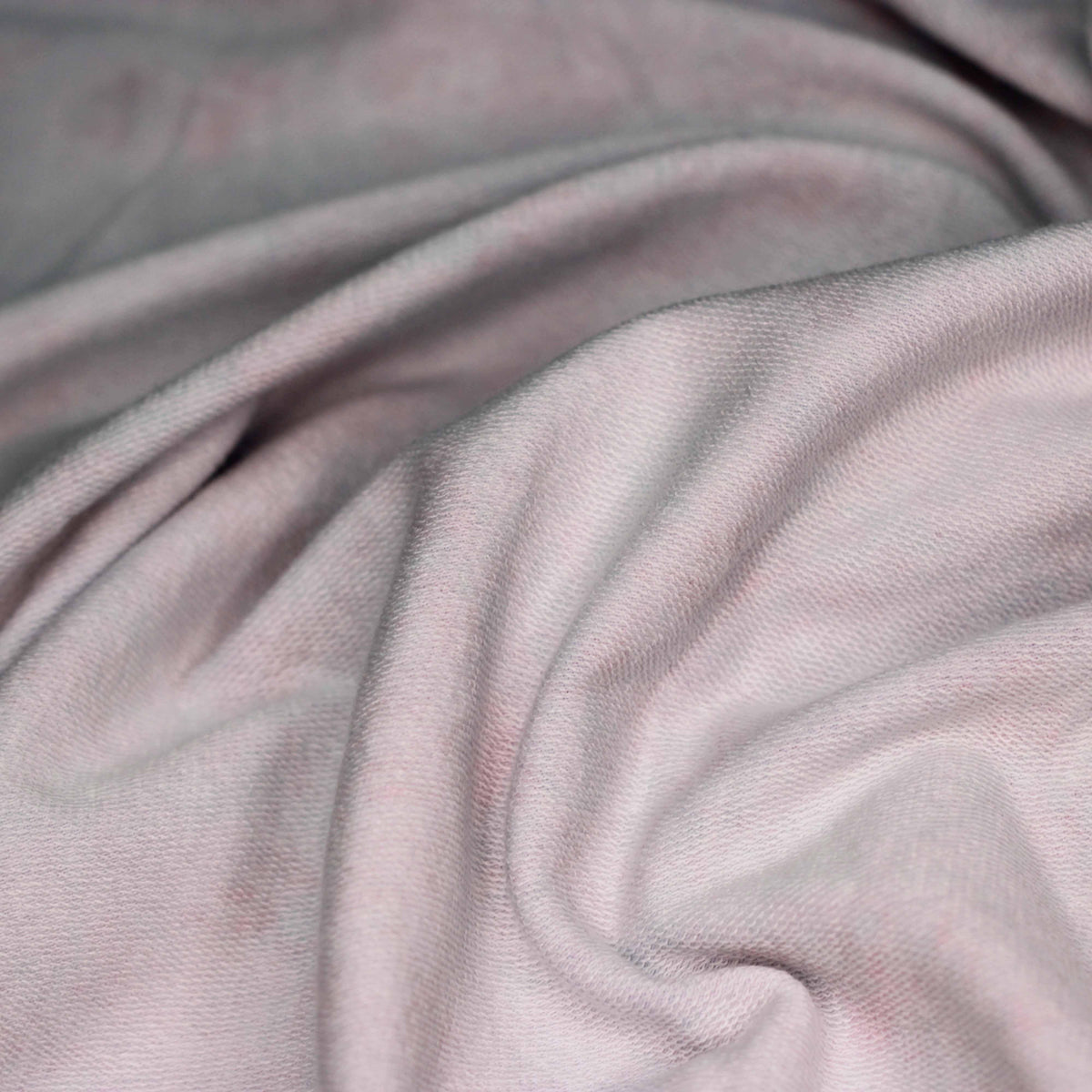 Close-up of draped, light-colored natural fabric from Nature's Fabrics.