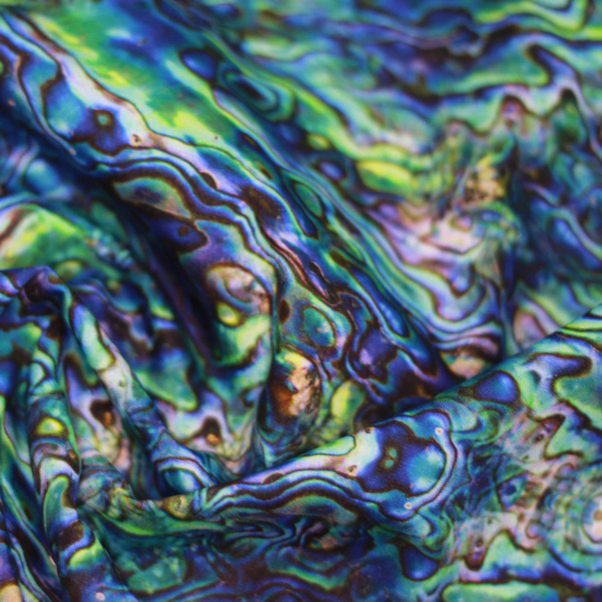Nature's Fabrics iridescent blue and green psychedelic patterned fabric