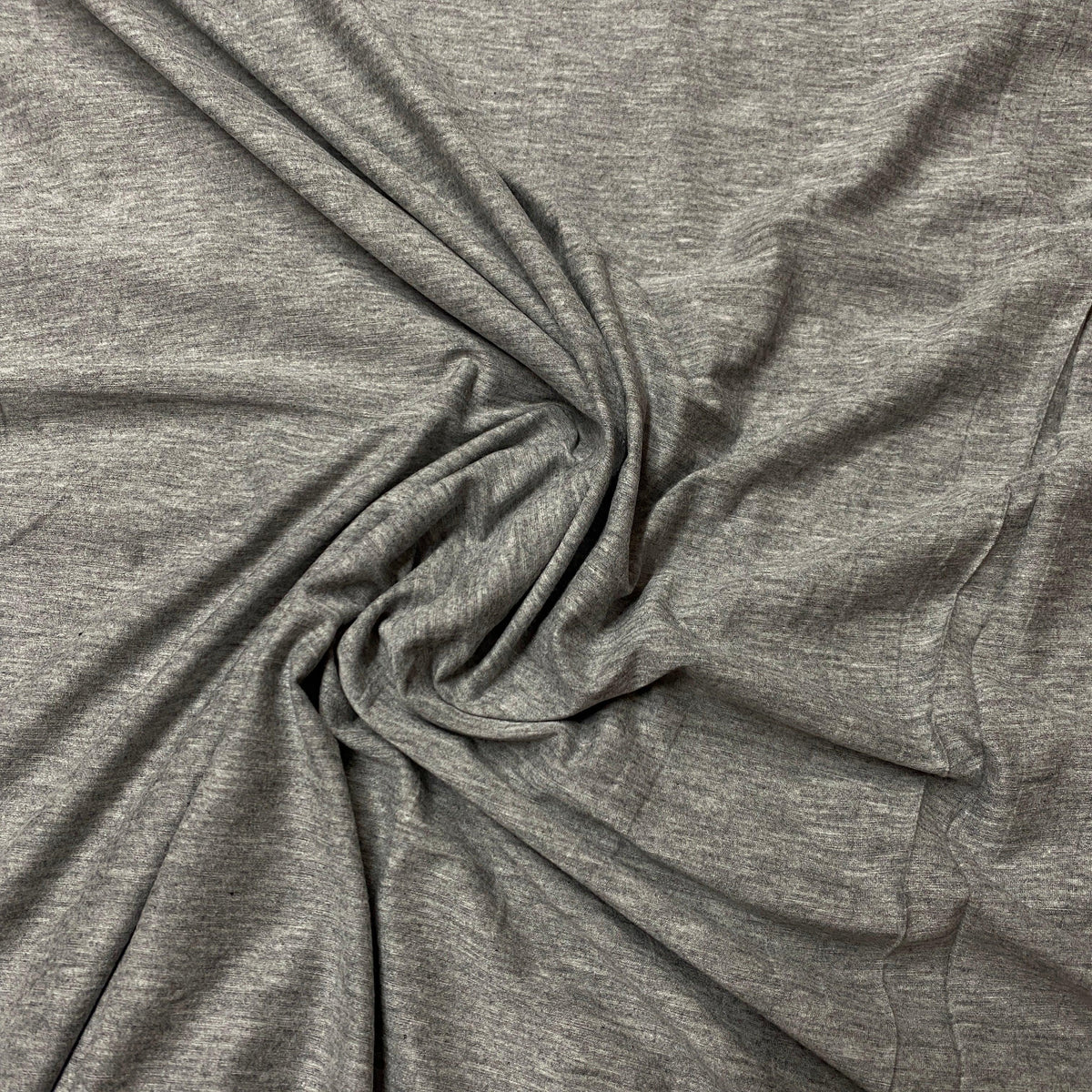 Grey heathered natural fabric swirled in a soft pile by Nature's Fabrics
