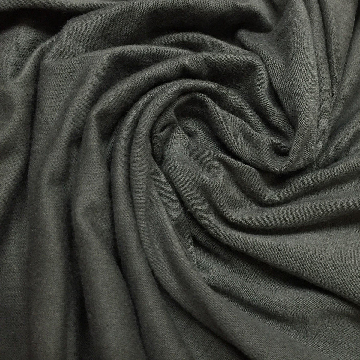 Nature's Fabrics dark grey organic fabric with soft, swirling folds