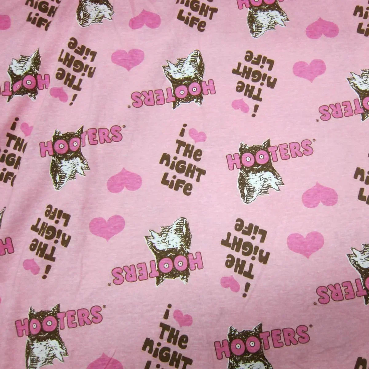 Pink Nature's Fabrics material with Hooters owls, hearts, and 'The Night Life' text pattern.