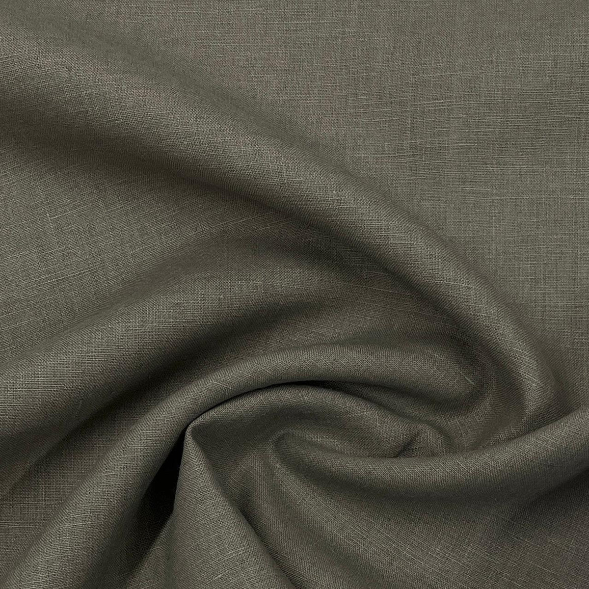 Close-up of draped grey natural linen fabric from Nature's Fabrics.