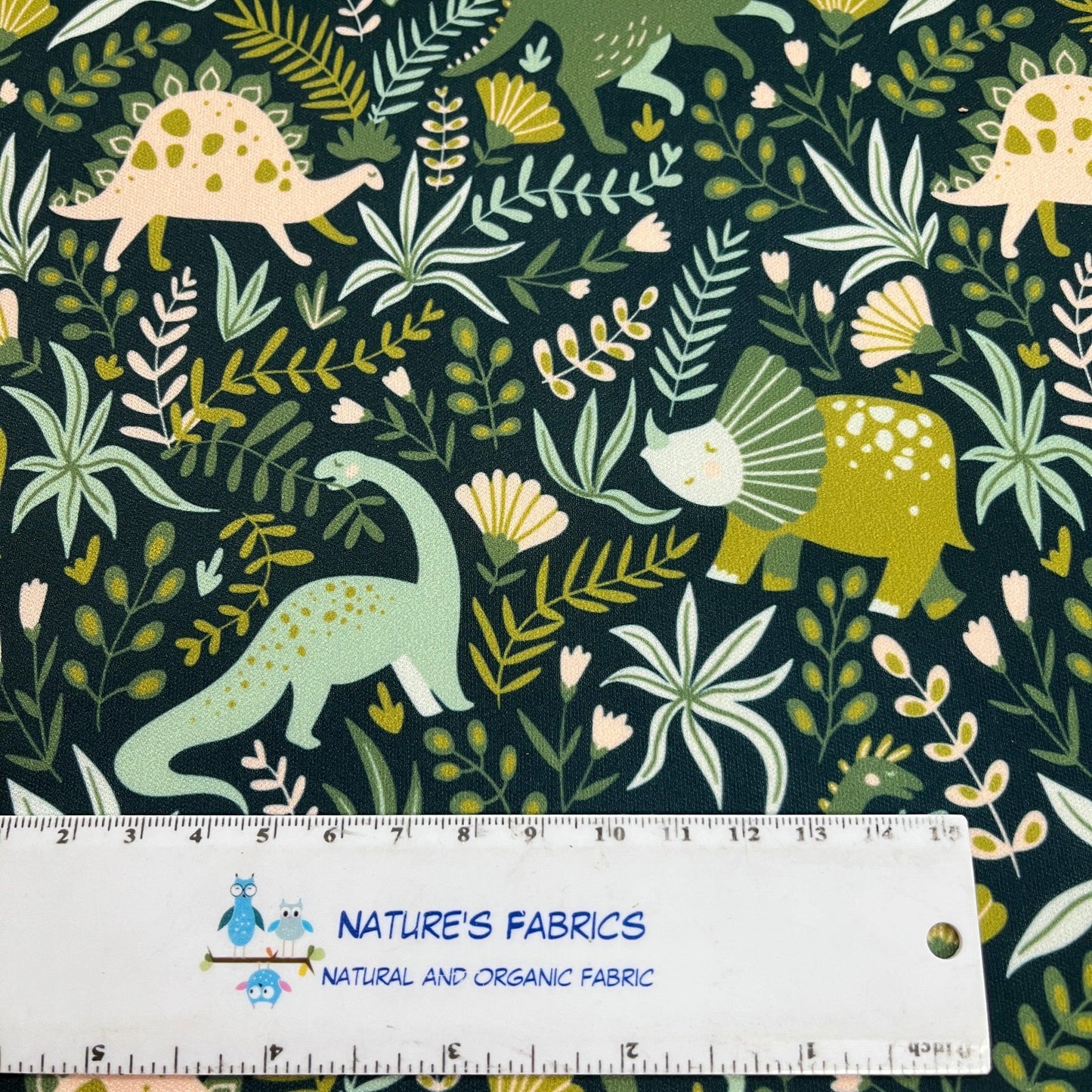 Dinosaurs on Green 1 mil PUL Fabric - Made in the USA - Nature's Fabrics