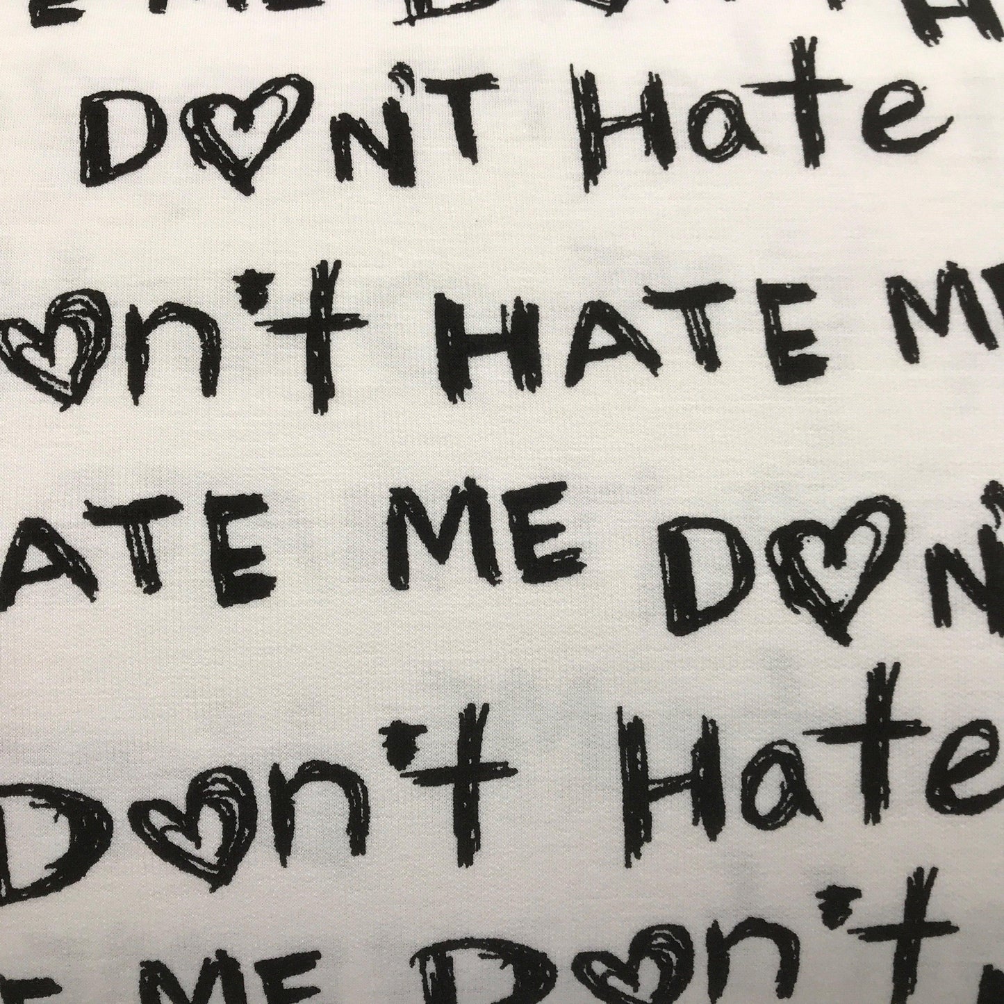 Don't Hate Me-on White Cotton/Poly French Terry Fabric - Nature's Fabrics