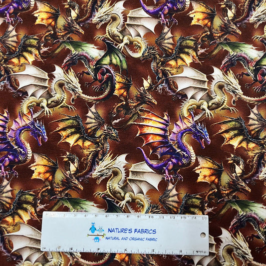 Nature's Fabrics dragon print organic fabric with a measuring ruler for scale.
