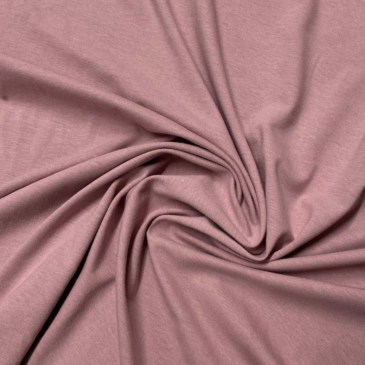 Mauve-colored natural fabric draped in soft folds from Nature's Fabrics