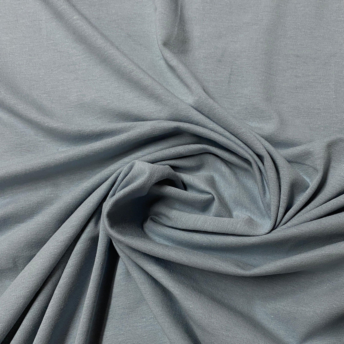 Draped light grey organic cotton fabric from Nature's Fabrics.