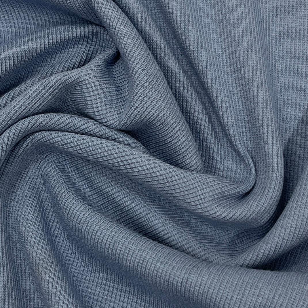 Close-up of draped grey ribbed natural fabric from Nature's Fabrics