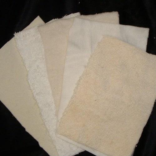 Assorted white and cream natural fabric swatches from Nature's Fabrics