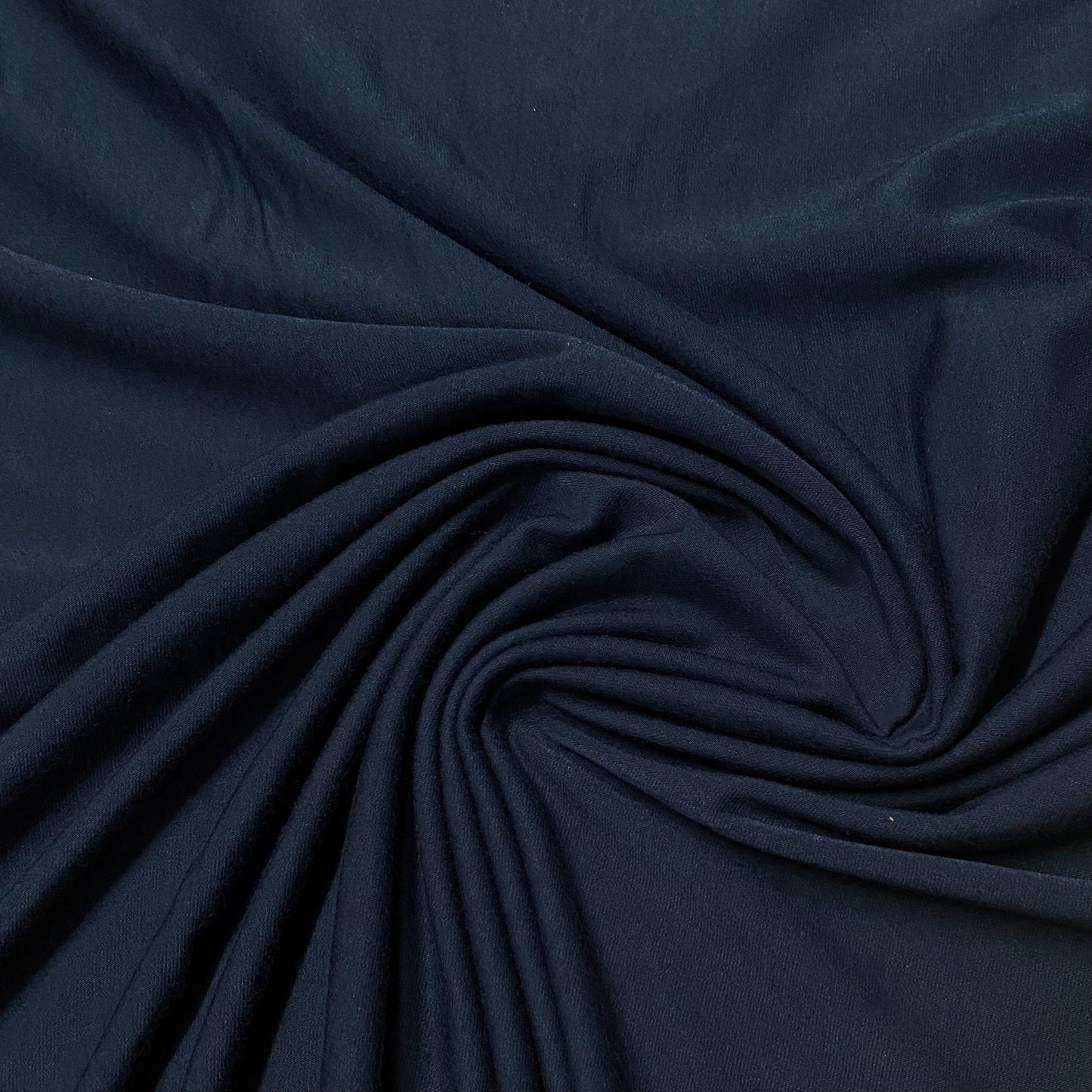 Close-up of draped navy blue fabric from Nature's Fabrics.