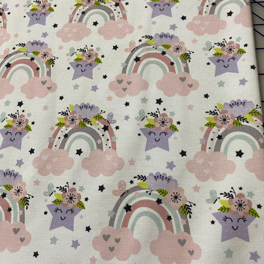 Nature's Fabrics cotton fabric with pastel rainbows, stars, and clouds print
