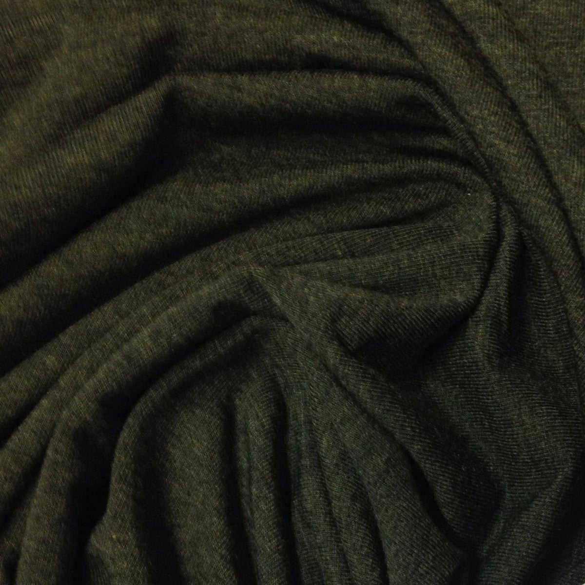 Close-up of draped, dark olive green organic fabric from Nature's Fabrics.