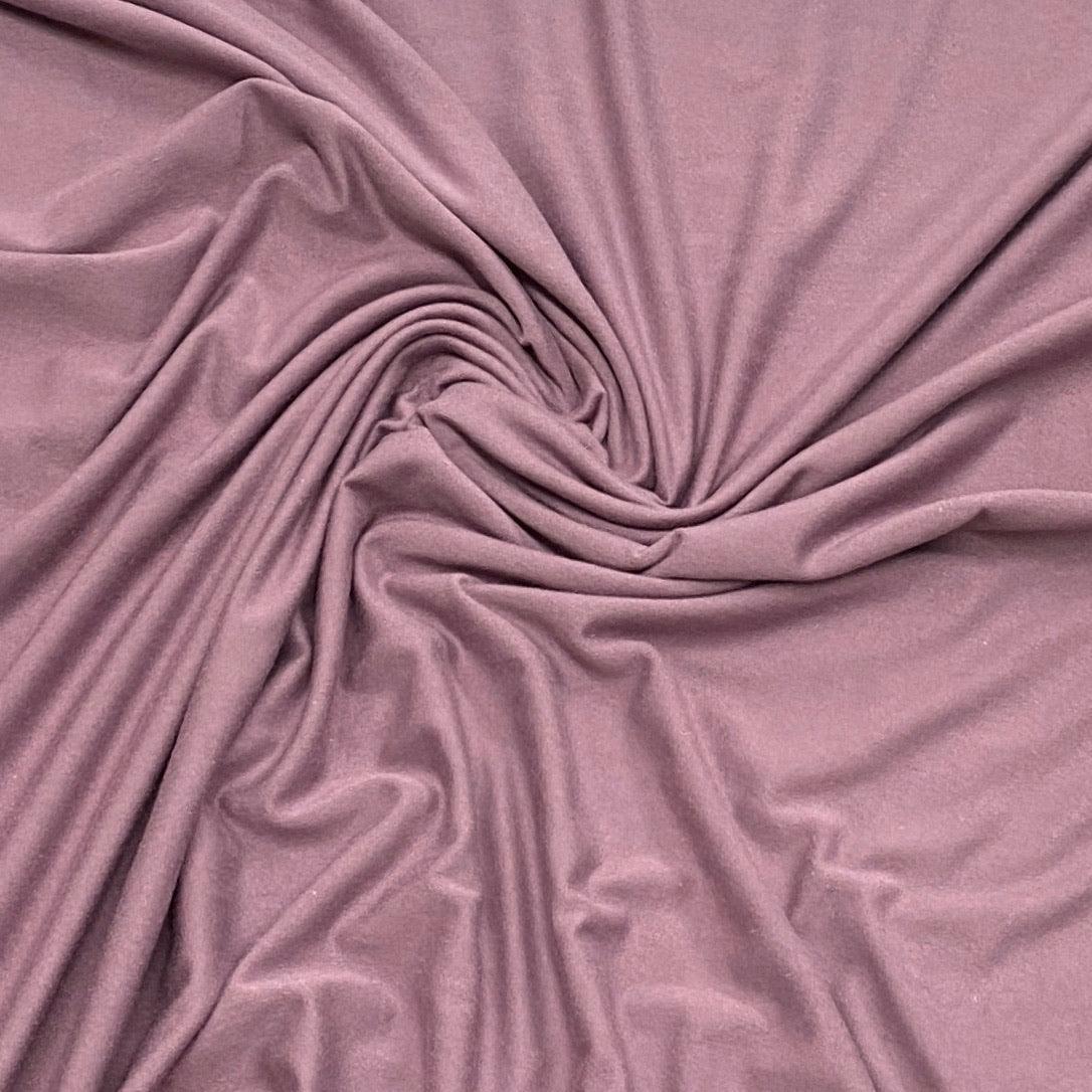 Nature's Fabrics premium mauve-colored natural fabric with soft, elegant folds.