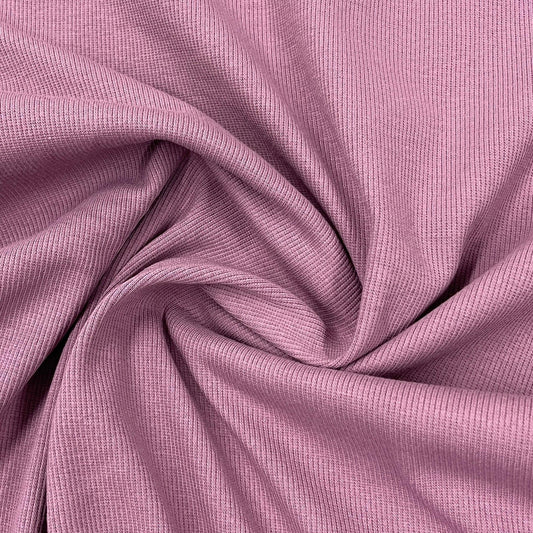 Mauve ribbed natural fabric by Nature's Fabrics, draped in soft folds.