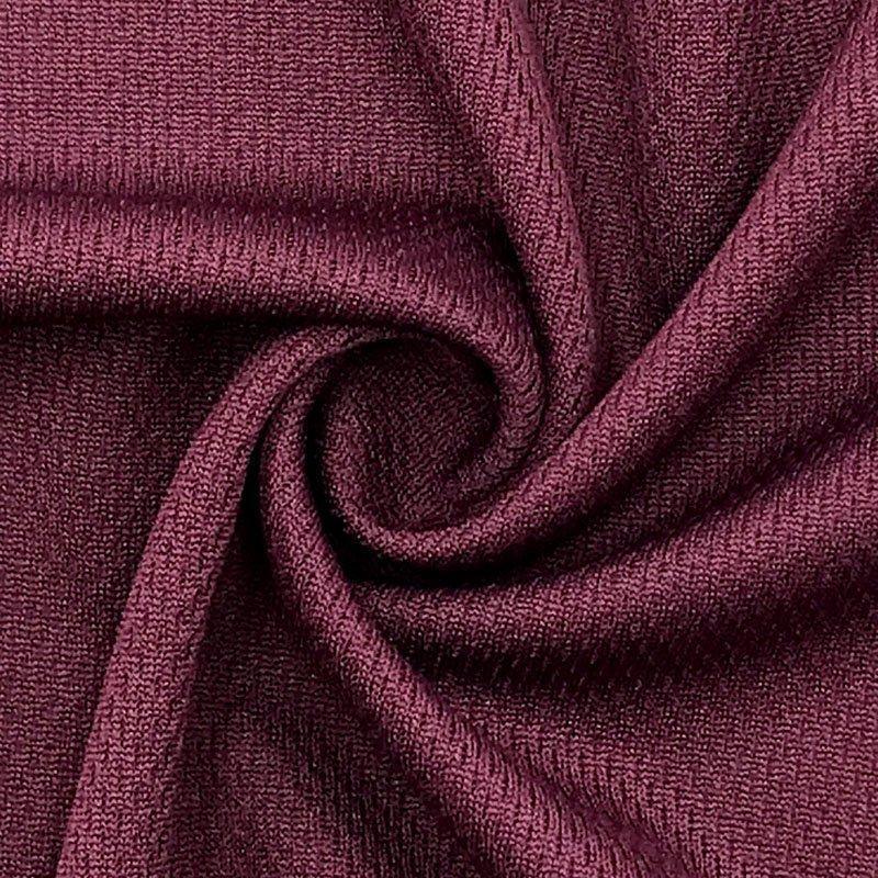 Close-up of maroon textured fabric draped in swirls from Nature's Fabrics