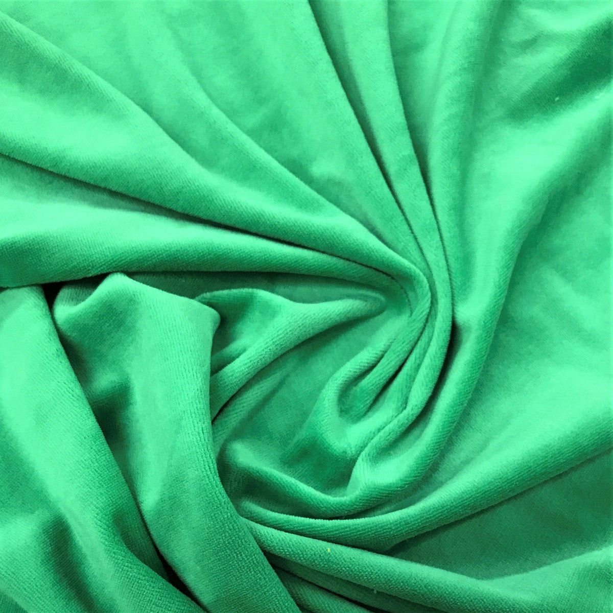 Close-up of draped green organic fabric from Nature's Fabrics