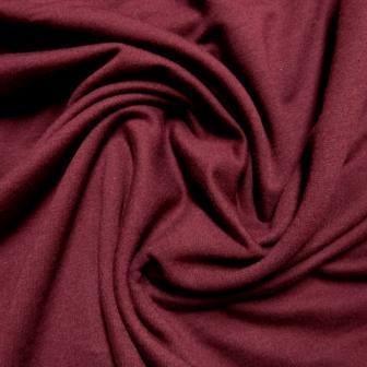 Close-up of draped burgundy premium natural fabric from Nature's Fabrics.