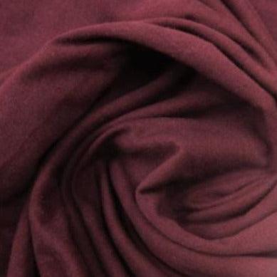 Close-up of draped burgundy natural fabric from Nature's Fabrics