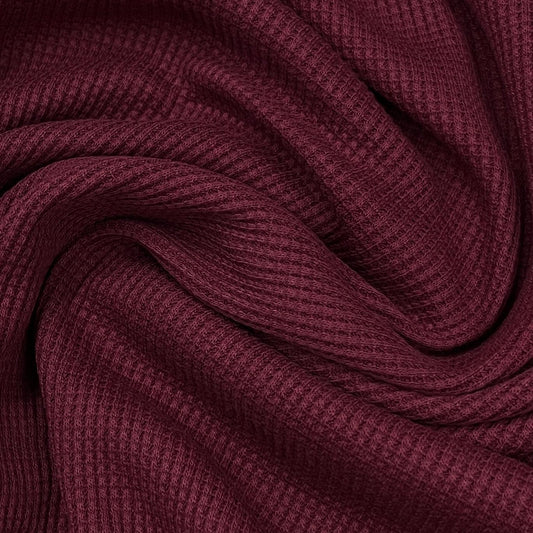 Close-up of maroon ribbed natural fabric from Nature's Fabrics.