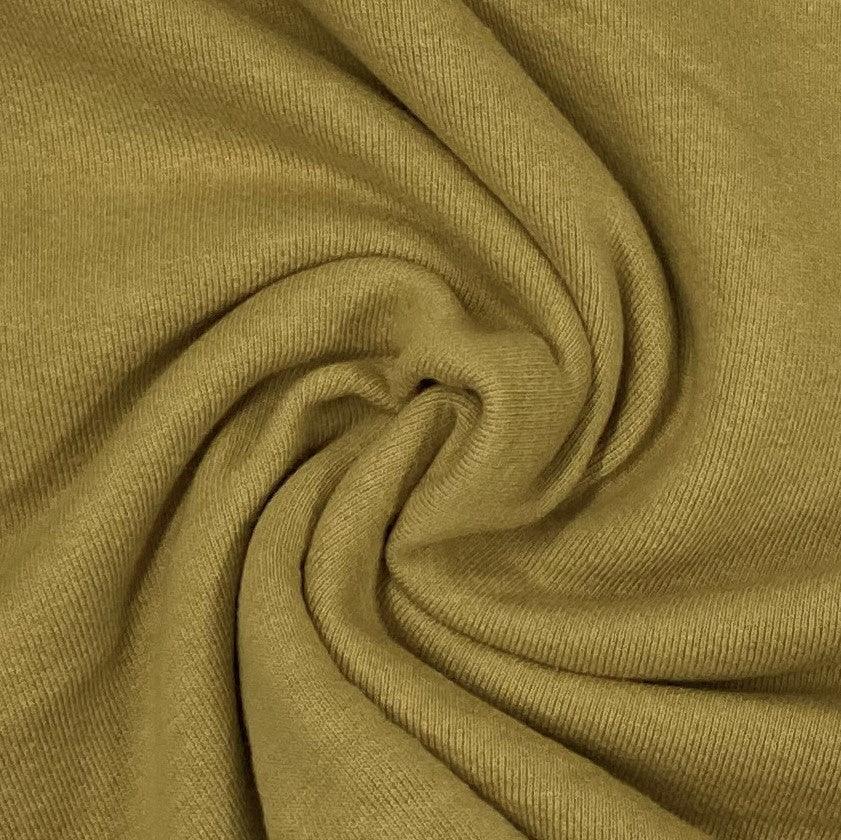 Olive green ribbed natural fabric from Nature's Fabrics, draped in soft folds.