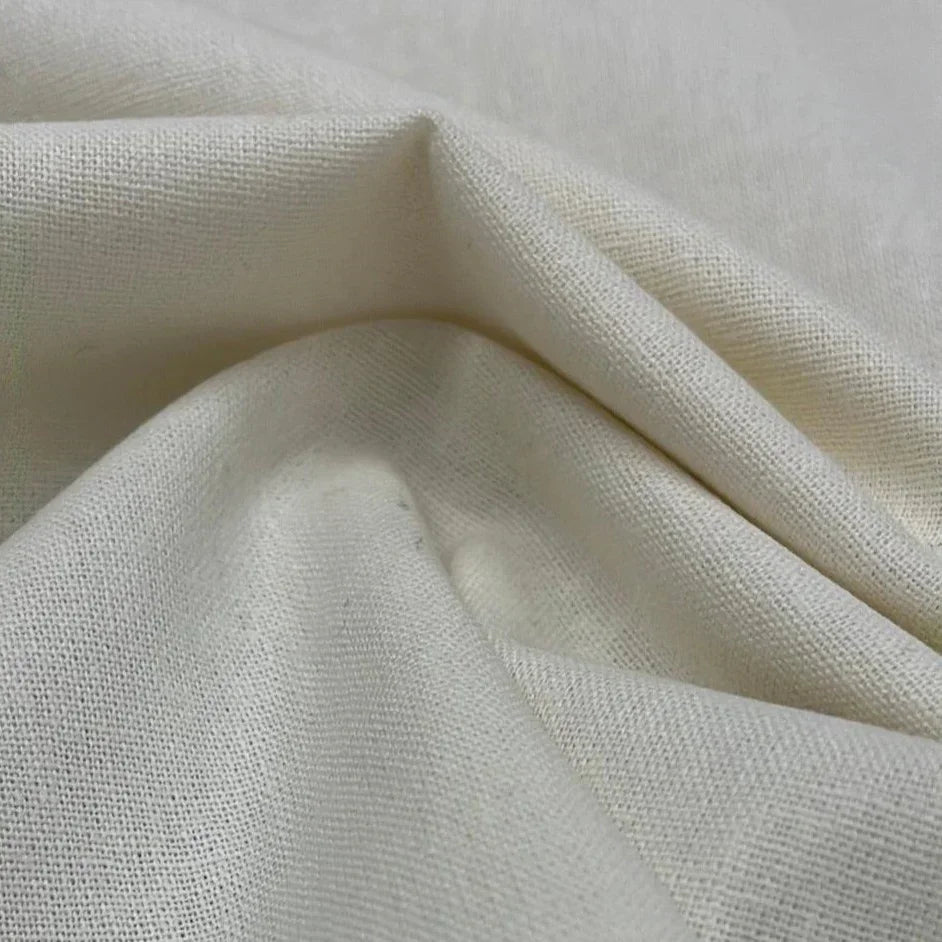 Close-up of draped off-white organic cotton fabric from Nature's Fabrics.