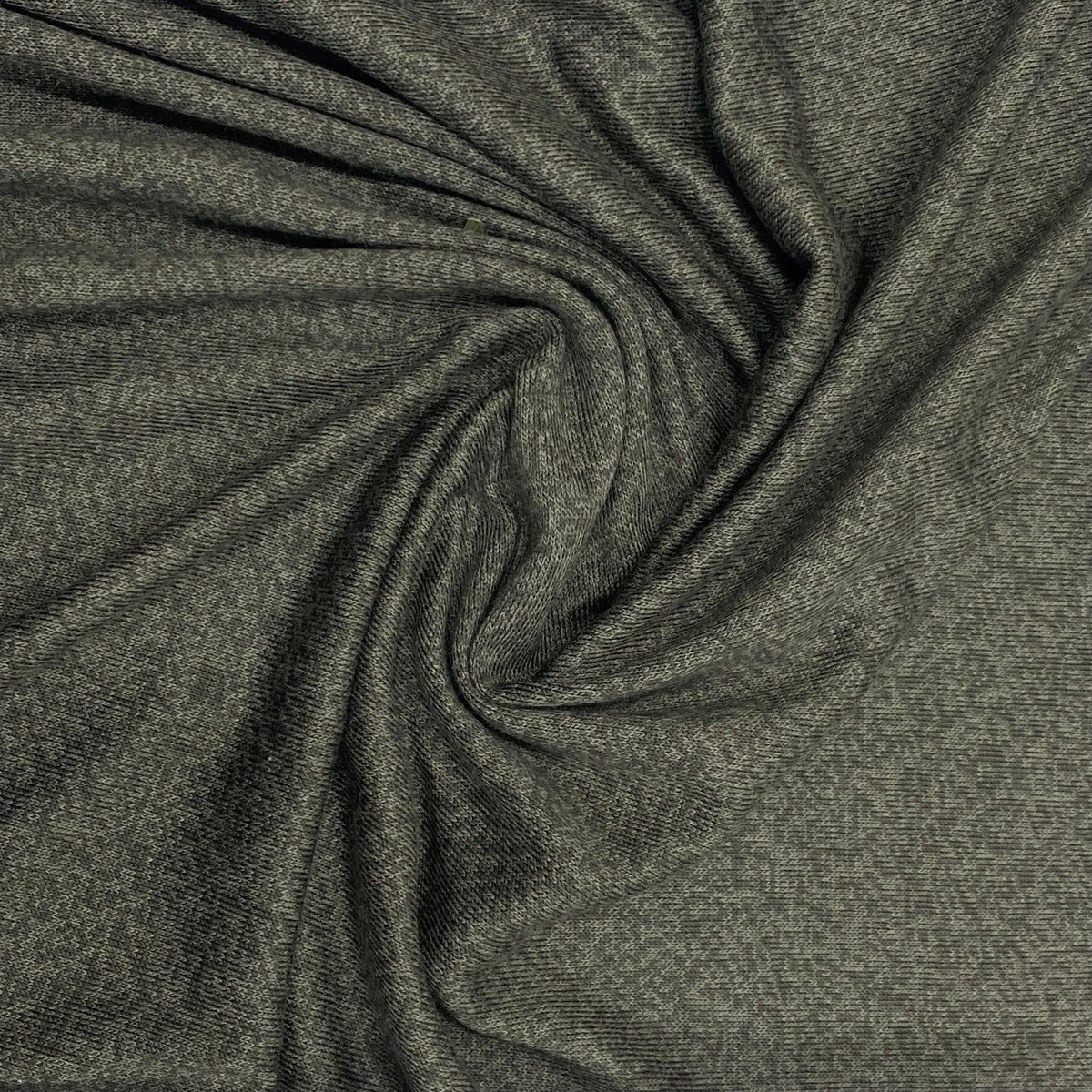 Nature's Fabrics charcoal grey organic fabric draped in a spiral pattern