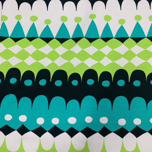 Nature's Fabrics organic cotton fabric with a teal, lime green, and black geometric pattern