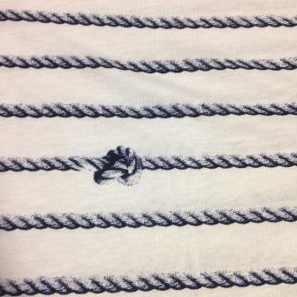 Nature's Fabrics white fabric with navy blue nautical rope stripes and a knot detail.