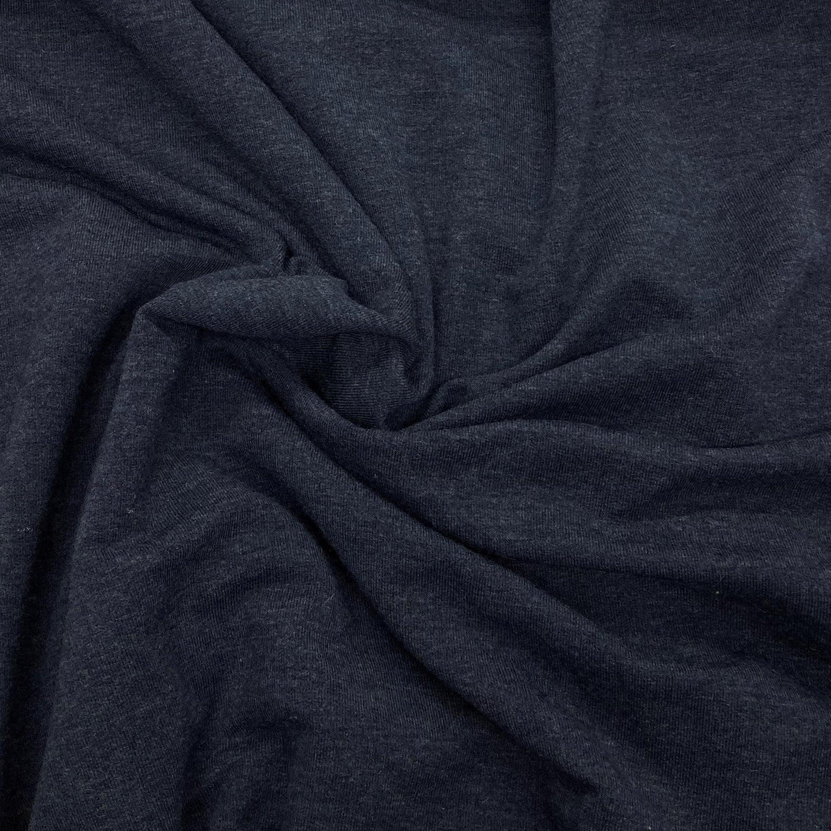 Nature's Fabrics dark charcoal grey natural fabric with soft folds and texture.