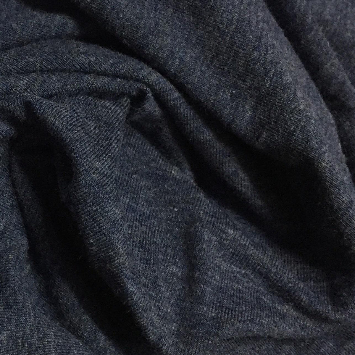 Close-up of draped dark navy blue organic fabric from Nature's Fabrics