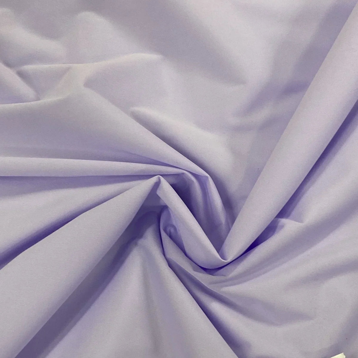Light purple premium natural fabric from Nature's Fabrics draped in folds