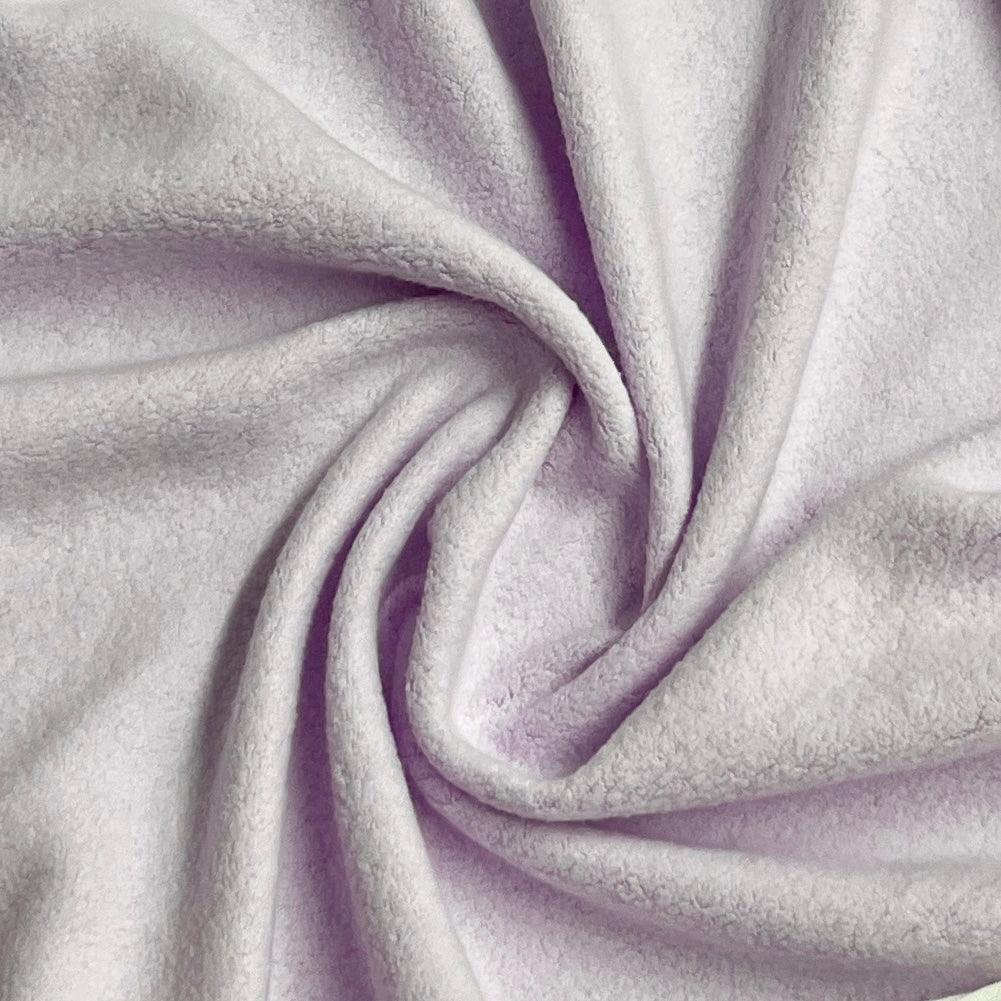Close-up of soft, draped lilac fleece fabric from Nature's Fabrics.