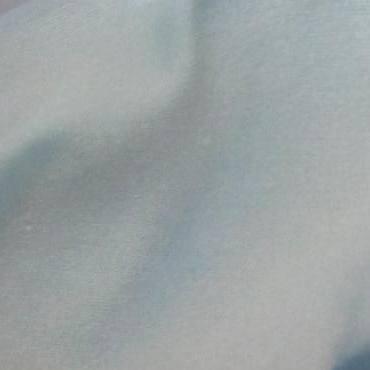 Close-up of light blue natural fabric from Nature's Fabrics