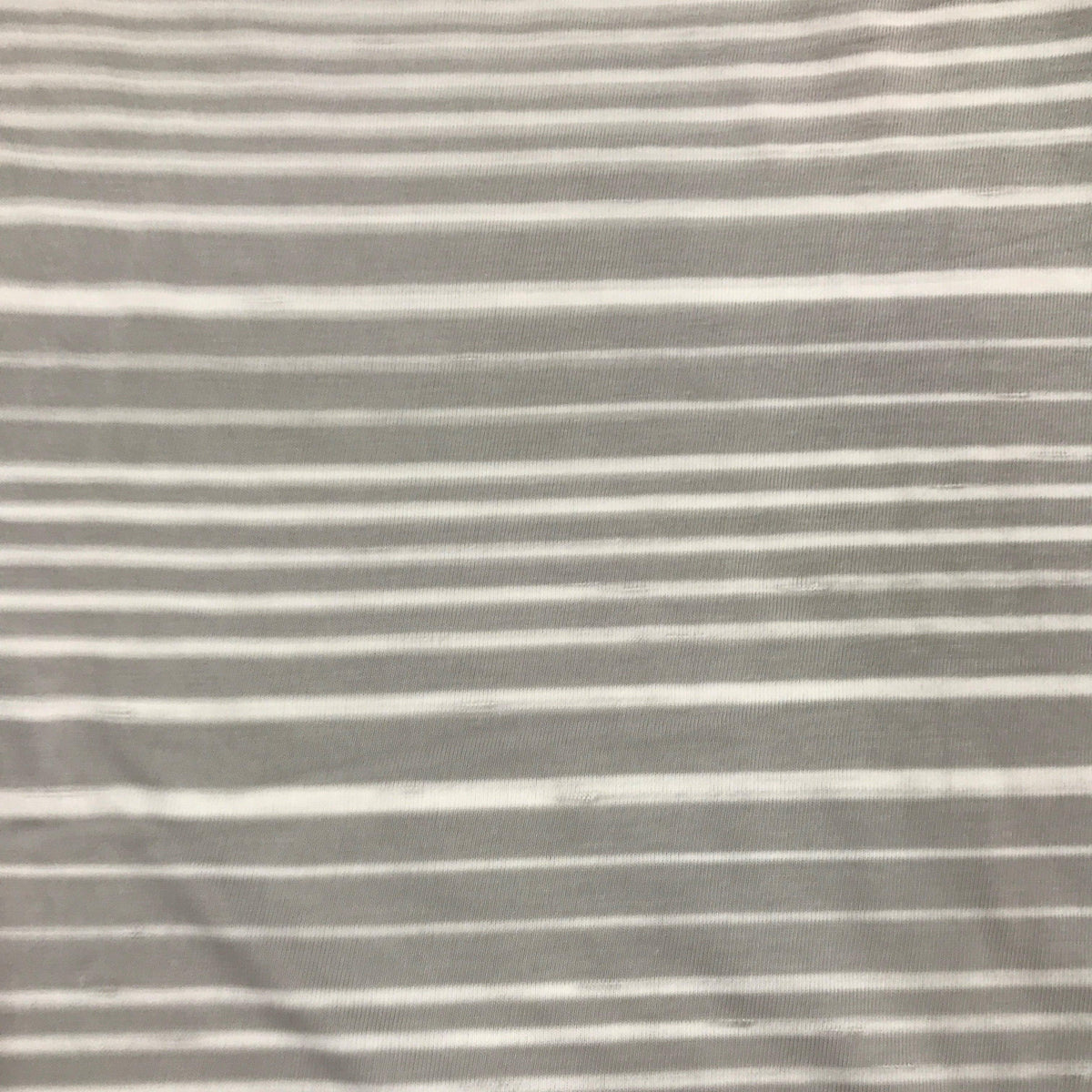 Close-up of Nature's Fabrics grey and white striped natural fabric.