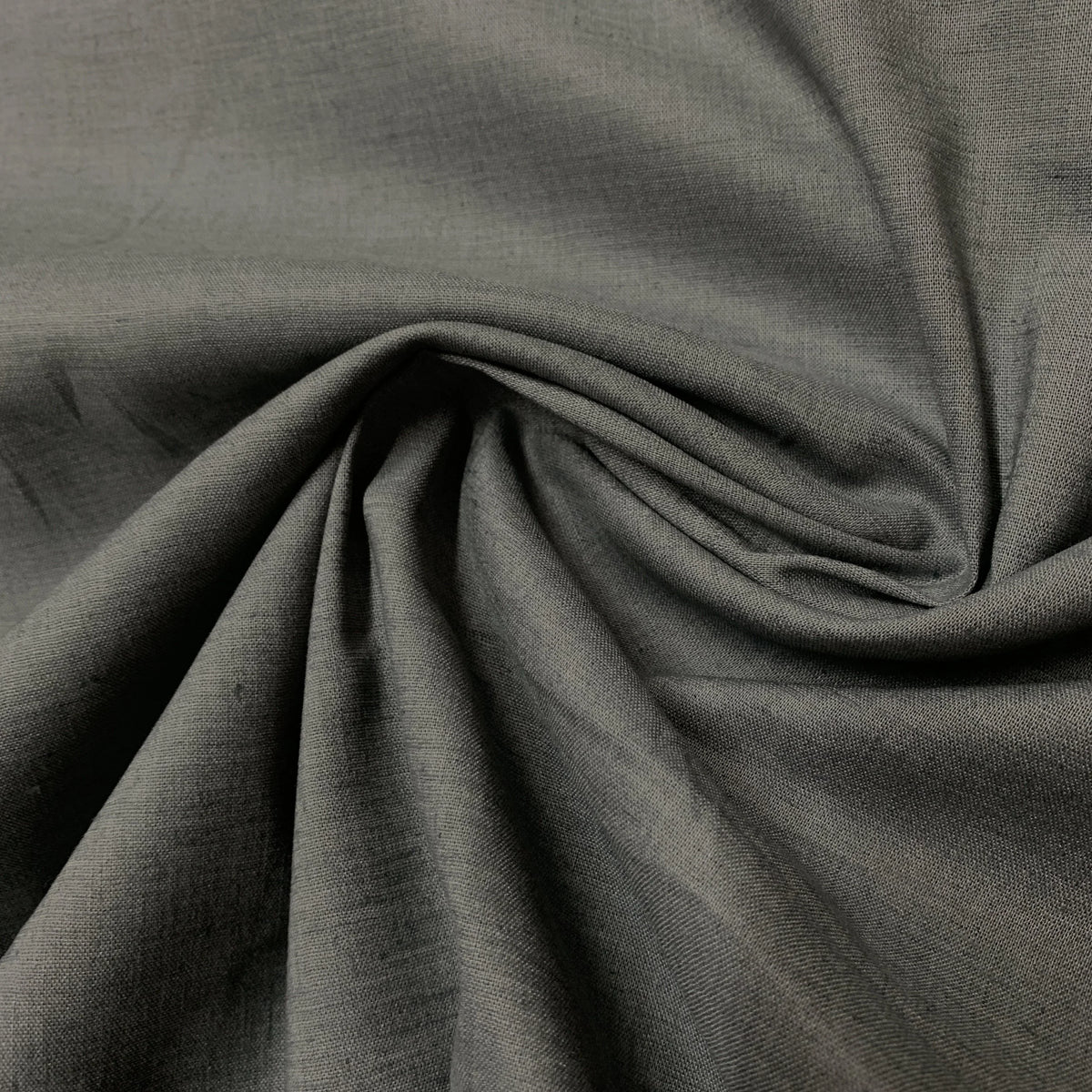 Close-up of draped charcoal grey premium natural fabric from Nature's Fabrics