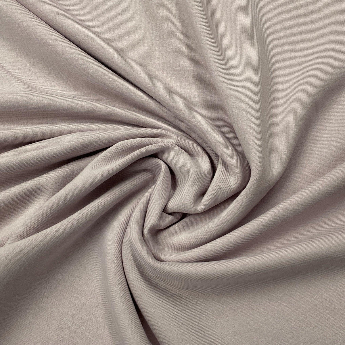 Nature's Fabrics soft mauve-grey organic fabric with elegant draped folds.