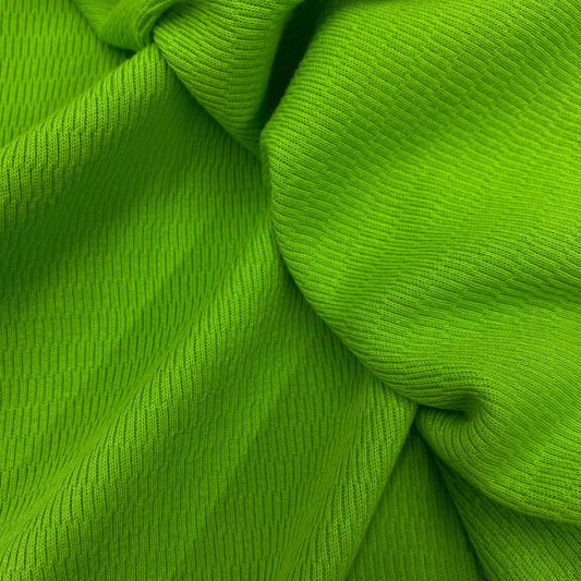 Close-up of draped, ribbed green natural fabric from Nature's Fabrics.