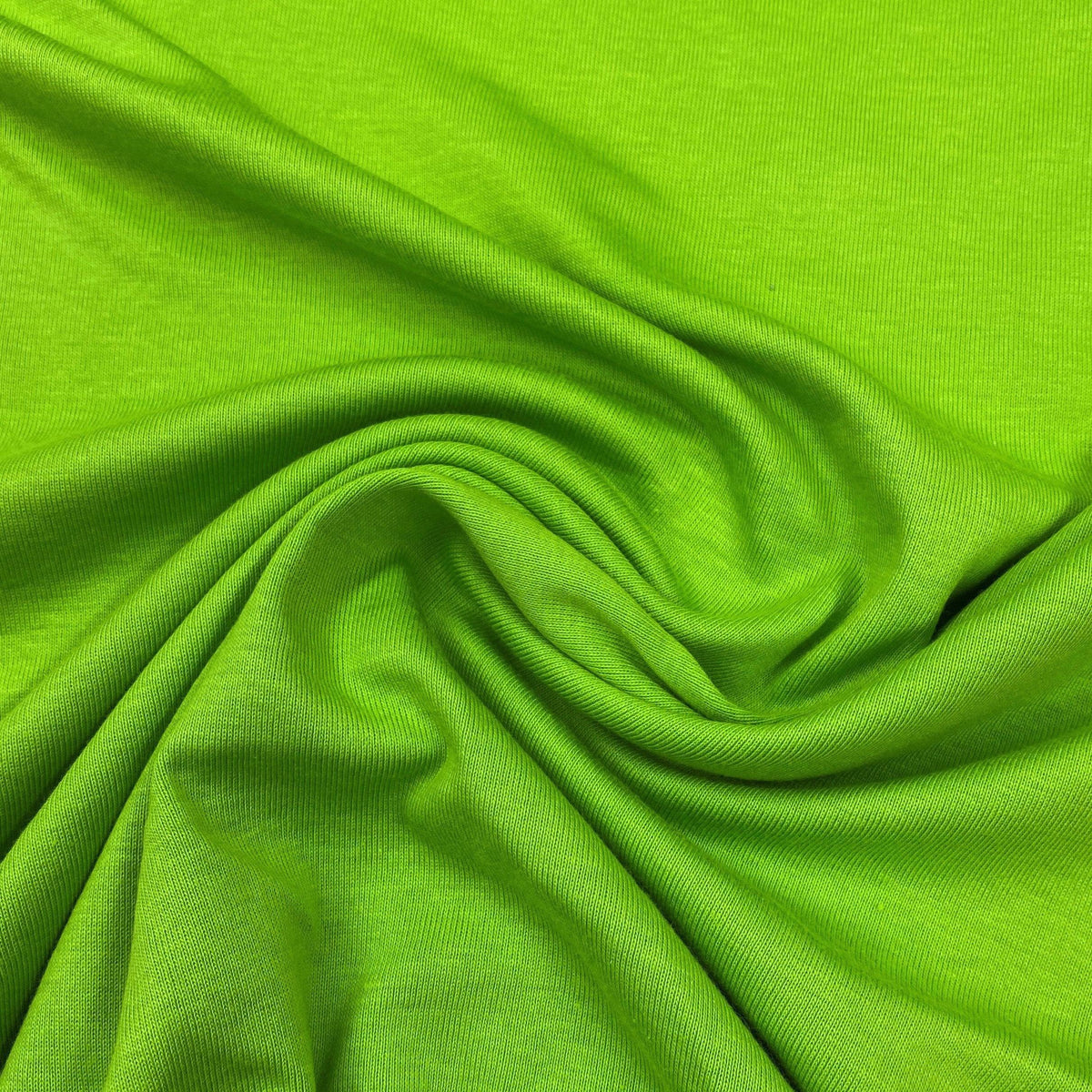 Close-up of draped lime green fabric from Nature's Fabrics.