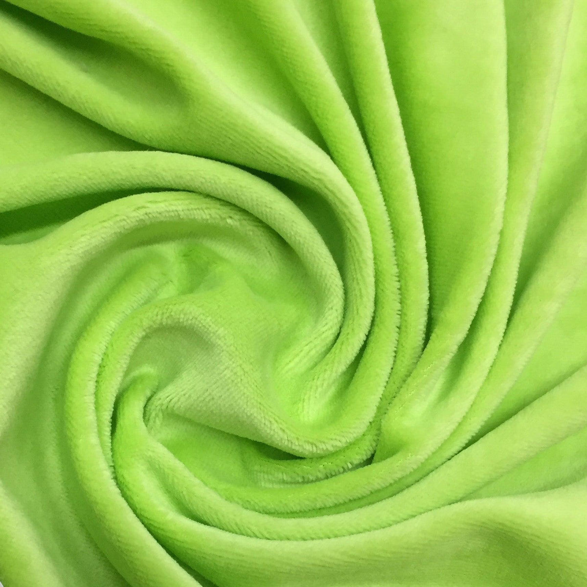 Neon green plush fabric swirled in a spiral pattern from Nature's Fabrics