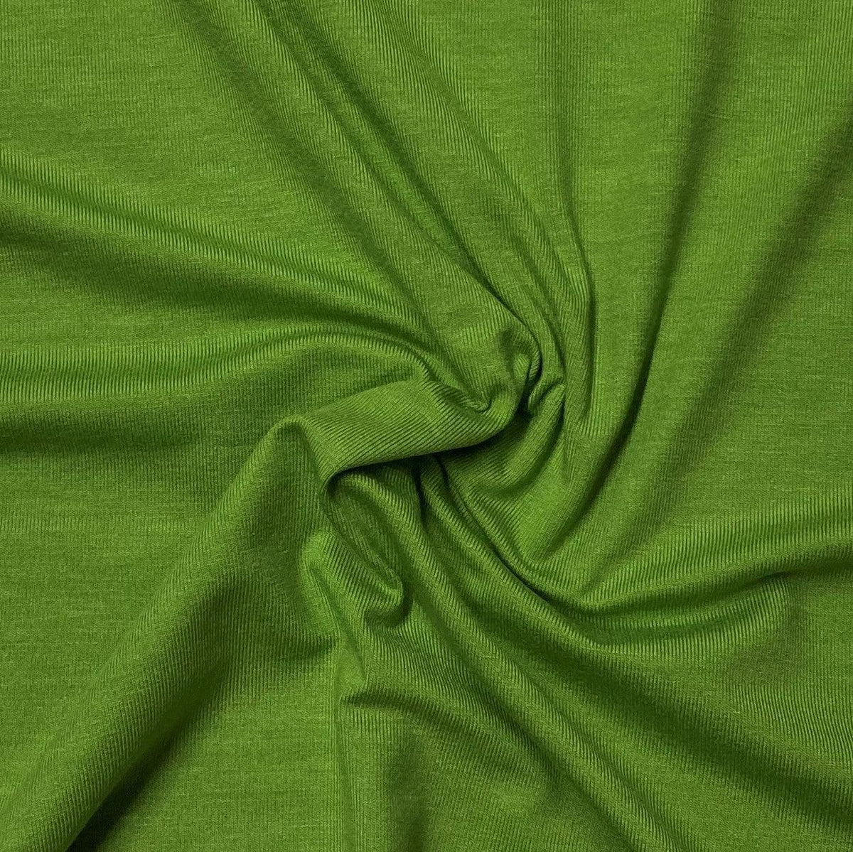 Draped lime green ribbed natural fabric from Nature's Fabrics.